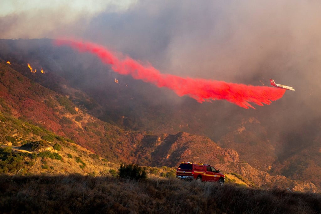 An air tanker drops retardant. Photo: Reuters