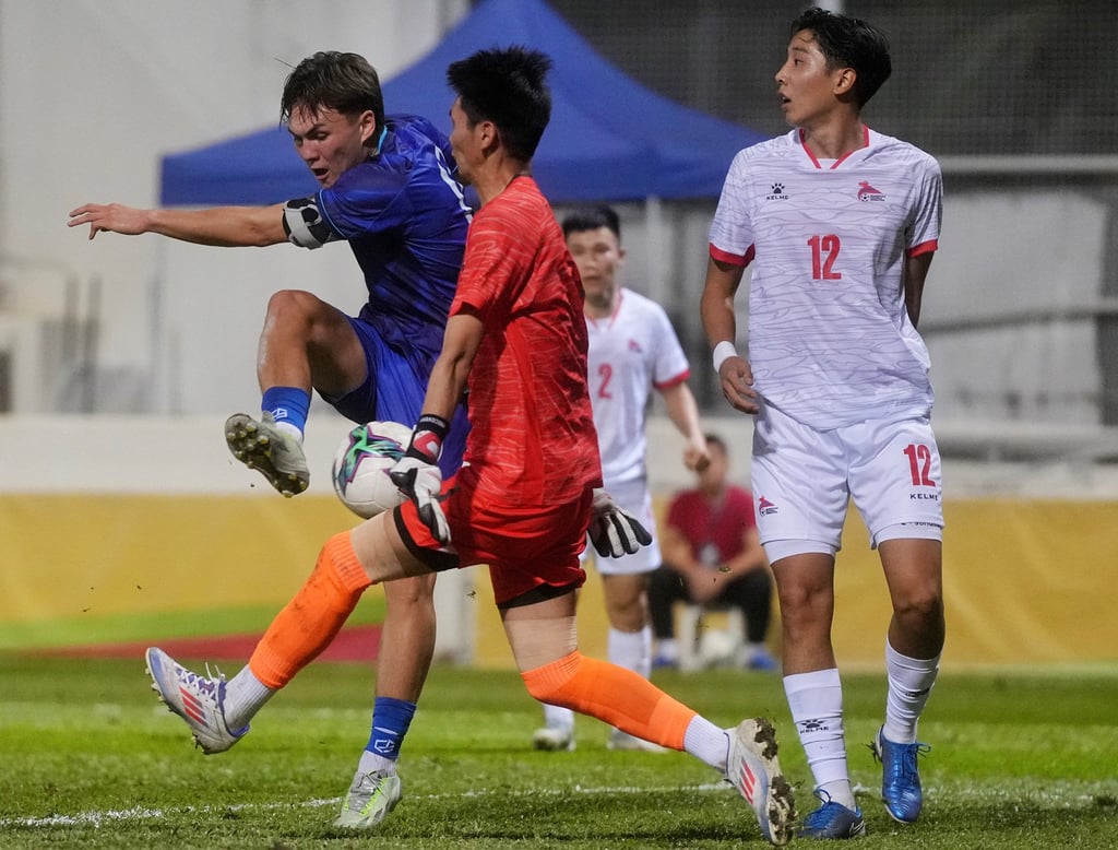 Miguel Sandberg tries to find a way through Mongolia keeper Tsenguun Khandaa. Photo: Elson Li Miguel Sandberg tries to find a way through Mongolia keeper Tsenguun Khandaa. Photo: Elson Li