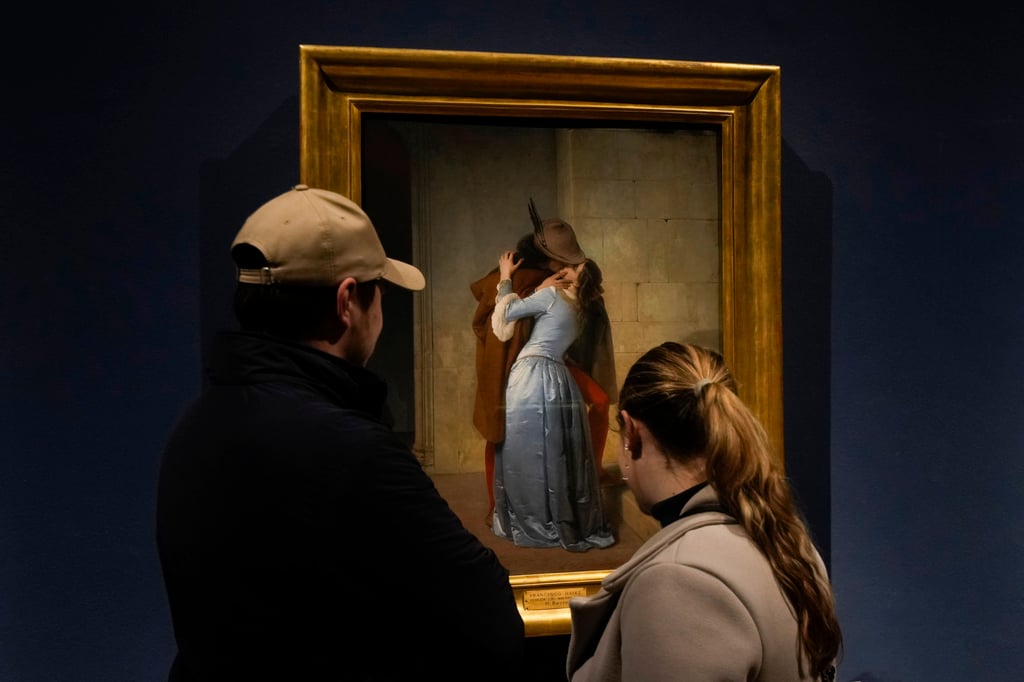 Visitors admire The Kiss by Francesco Hayez at the Pinacoteca Museum of Brera, in Milan, Italy. Photo: AP