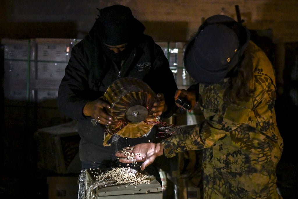 Syrian rebel fighters inspect electrical storage components that were used to hide pills of Captagon. Photo: AFP