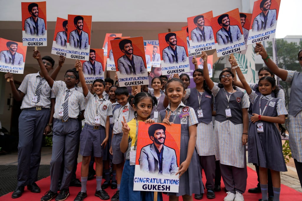 Students at Gukesh Dommaraju’s school in Chennai celebrate after his title win. Photo: AP Students at Gukesh Dommaraju’s school in Chennai celebrate after his title win. Photo: AP