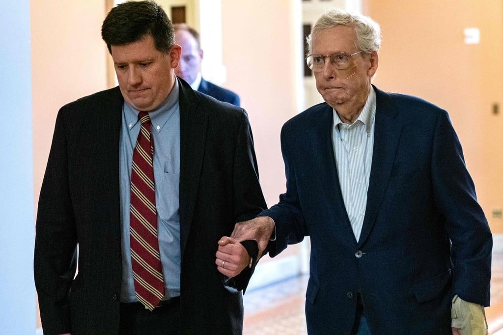 US Senator Mitch McConnell (right) is assisted by a staff member as he heads for the Senate Chamber in Washington on Wednesday. Photo: AFP US Senator Mitch McConnell (right) is assisted by a staff member as he heads for the Senate Chamber in Washington on Wednesday. Photo: AFP