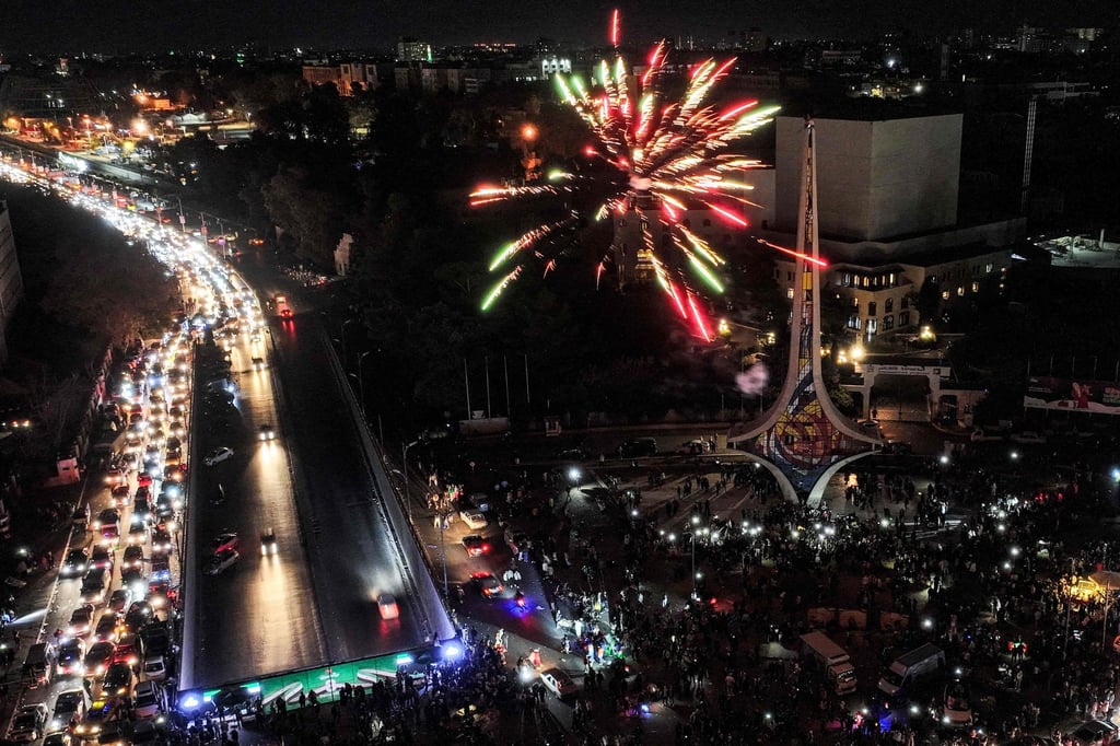 Fireworks erupting above people celebrating the ousting of Syria’s president Bashar al-Assad at Umayyad Square in Damascus on Friday. Photo: AFP