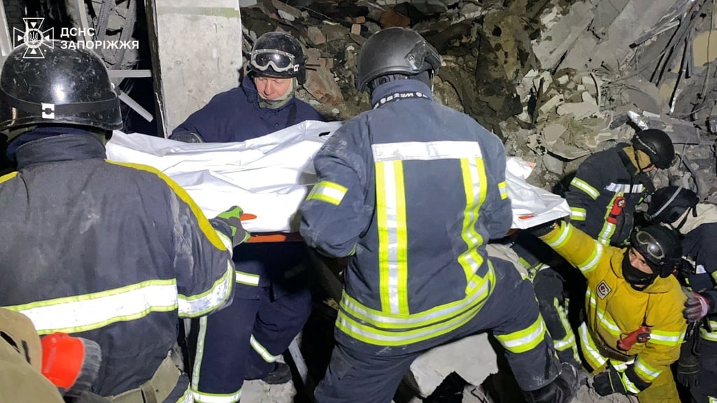 Rescuers in Zaporizhzhia, Ukraine, carry a body found in the debris of a building after a Russian missile strike this month. Photo: Handout via Reuters Rescuers in Zaporizhzhia, Ukraine, carry a body found in the debris of a building after a Russian missile strike this month. Photo: Handout via Reuters