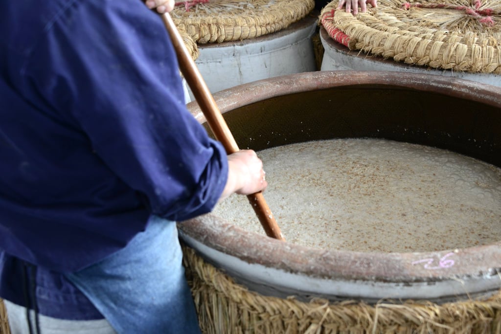 Jianhu Lake water is mixed with yeast and rice at Dong Qu Shaoxing Winery. This mixture is poured into cooled rice in a vat and mixed, after which they sit for four days. Photo: Evelyn Chen Jianhu Lake water is mixed with yeast and rice at Dong Qu Shaoxing Winery. This mixture is poured into cooled rice in a vat and mixed, after which they sit for four days. Photo: Evelyn Chen