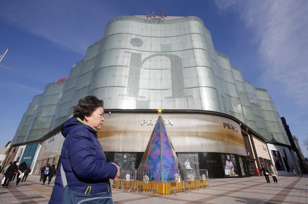 A woman walks past an Intime Lotte Department Store in downtown Beijing, January 10, 2017. Photo: Reuters A woman walks past an Intime Lotte Department Store in downtown Beijing, January 10, 2017. Photo: Reuters