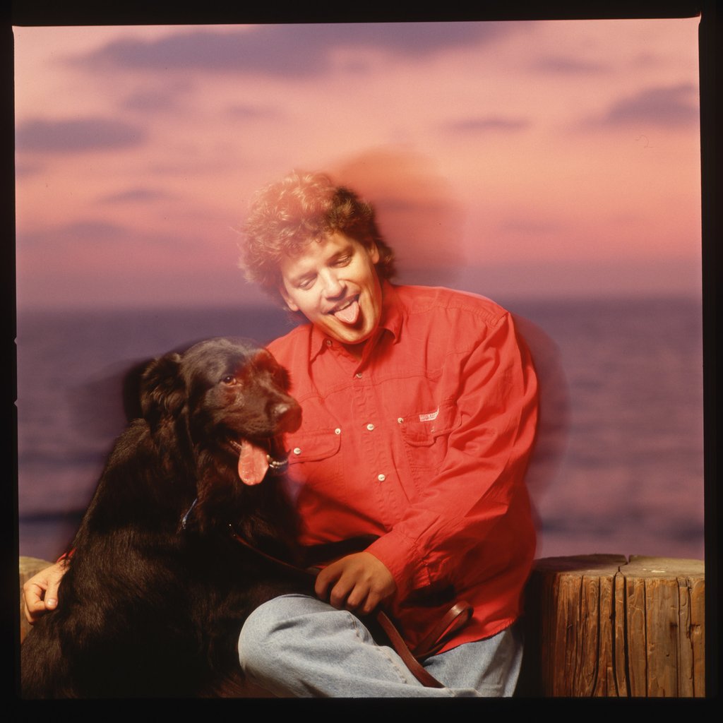 Roger Clinton, singer and brother of President Bill Clinton, with a black dog. Photo: Getty Images Roger Clinton, singer and brother of President Bill Clinton, with a black dog. Photo: Getty Images