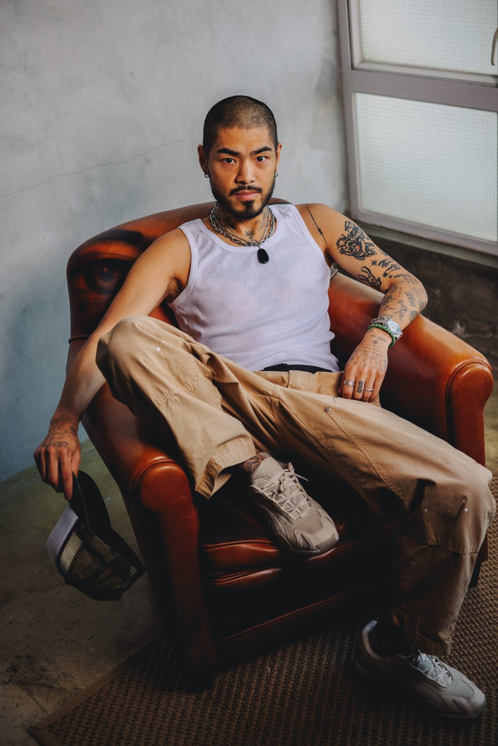 Mr Koo lounging at his Chai Wan studio in Hong Kong. Photo: Jocelyn Tam