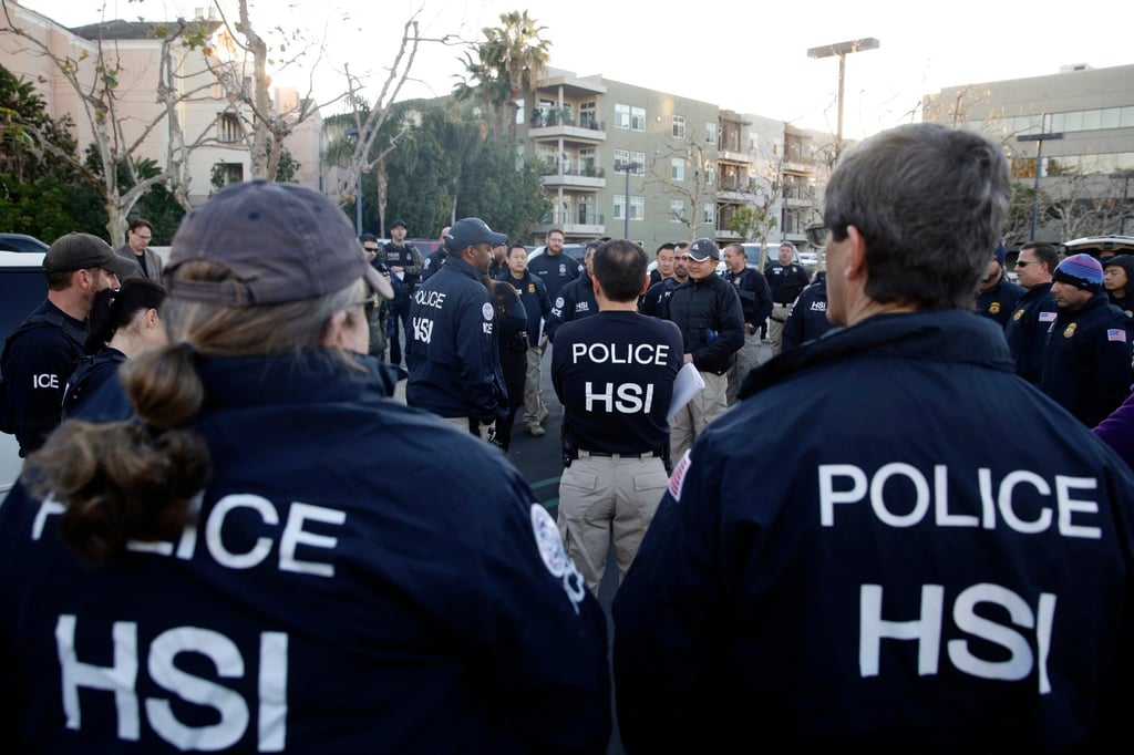 Federal agents before raiding an upscale residential complex in 2015. File photo: AP