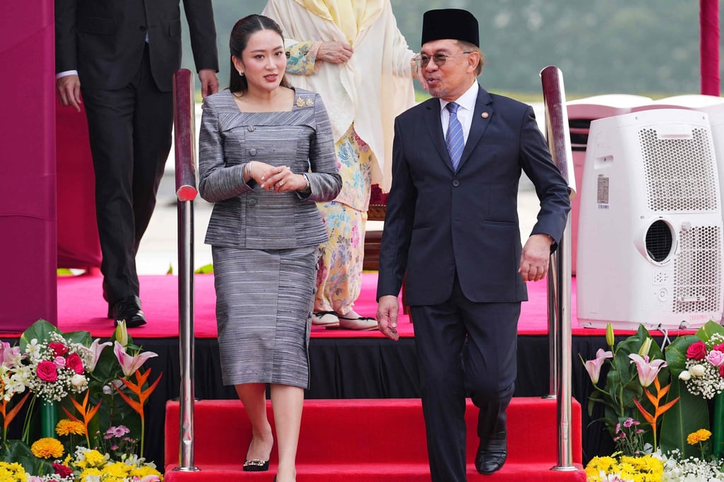 Thailand’s Prime Minister Paetongtarn Shinawatra walks with Malaysia’s Prime Minister Anwar Ibrahim during a welcoming ceremony in Putrajaya on Monday. Photo: AFP Thailand’s Prime Minister Paetongtarn Shinawatra walks with Malaysia’s Prime Minister Anwar Ibrahim during a welcoming ceremony in Putrajaya on Monday. Photo: AFP
