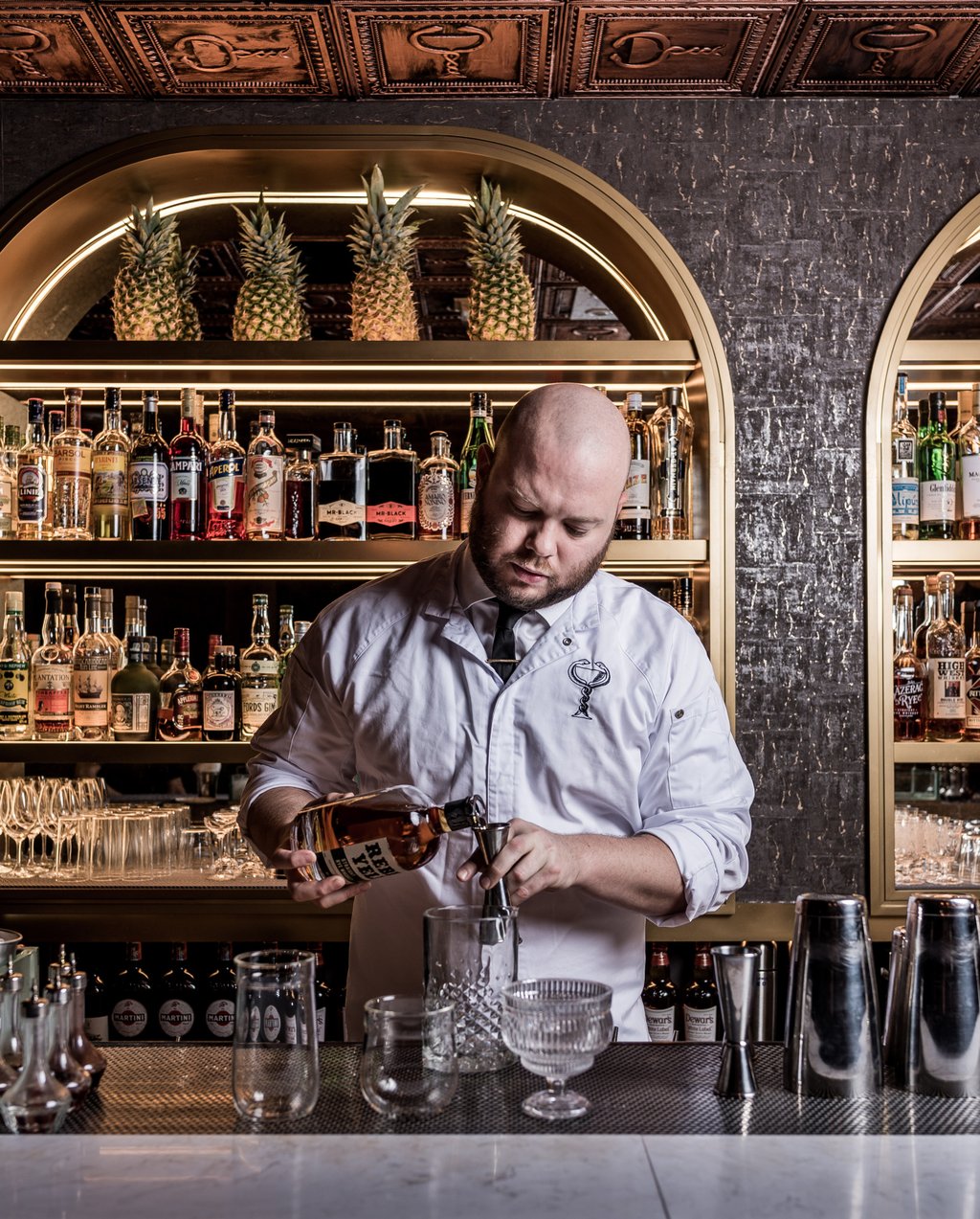Founder John Nugent behind the bar at The Diplomat. Photo: Handout Founder John Nugent behind the bar at The Diplomat. Photo: Handout