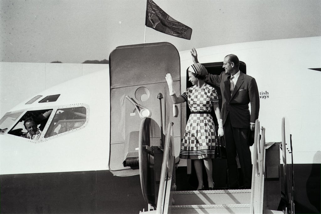 Queen Elizabeth and Prince Philip wave as they step out from their aircraft on arrival at Kai Tak Airport, in 1975. Photo: SCMP Queen Elizabeth and Prince Philip wave as they step out from their aircraft on arrival at Kai Tak Airport, in 1975. Photo: SCMP