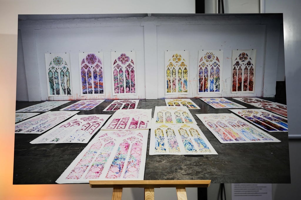 Sketches made by Claire Tabouret are displayed at a press conference in Paris on Wednesday after she and Atelier Simon-Marq were selected to create new stained glass windows for the Notre Dame cathedral. Photo: AFP
