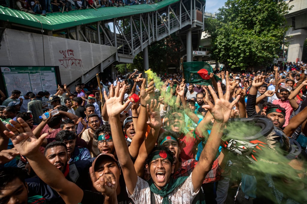 Protesters shout slogans as they celebrate Prime Minister Sheikh Hasina’s resignation, in Dhaka, Bangladesh on August 5. Photo: AP Protesters shout slogans as they celebrate Prime Minister Sheikh Hasina’s resignation, in Dhaka, Bangladesh on August 5. Photo: AP