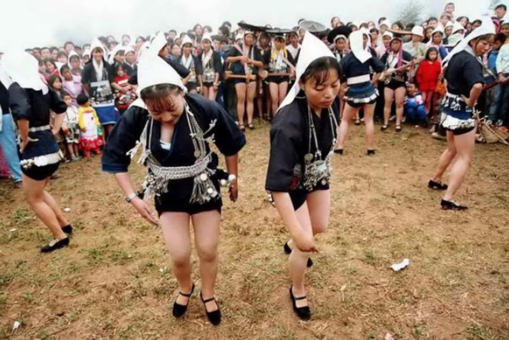 Yiche ethnic minority women dance to show of their strong legs which denote farming prowess and physical strength. Photo: Sina Yiche ethnic minority women dance to show of their strong legs which denote farming prowess and physical strength. Photo: Sina