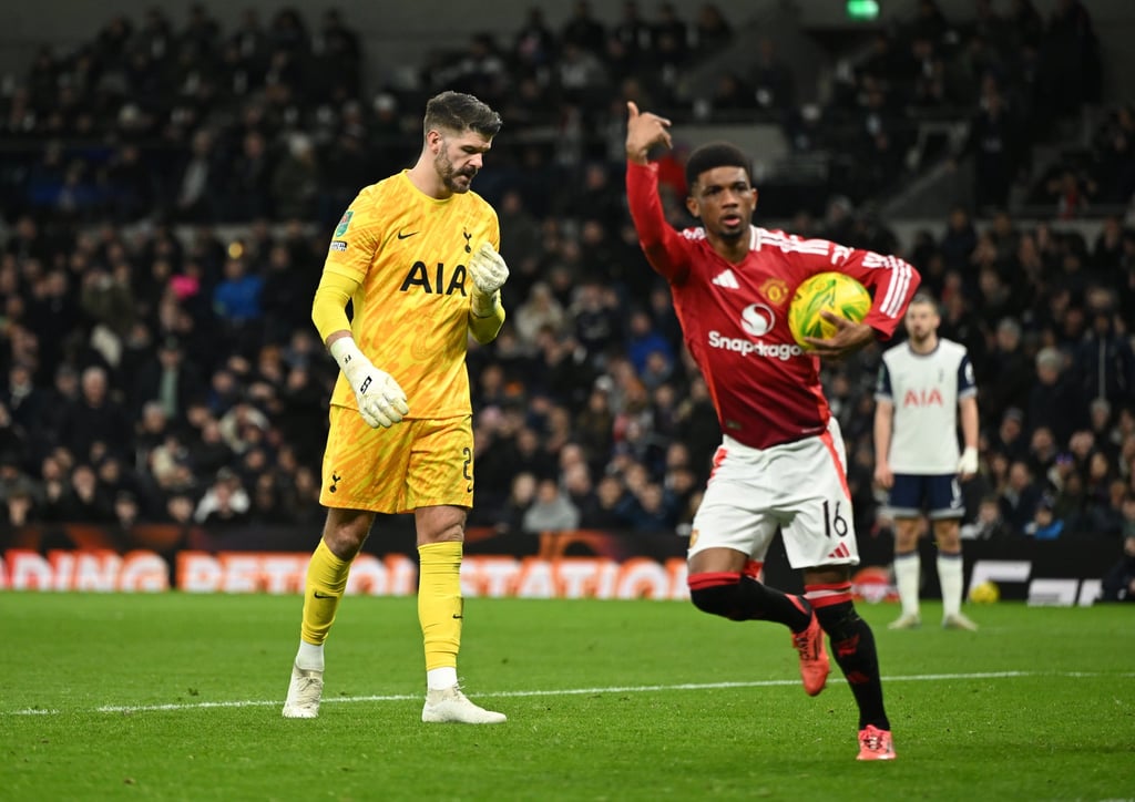 Tottenham goalkeeper Fraser Forster (left) lowers his head after allowing Amad Diallo to score. Photo: EPA-EFE Tottenham goalkeeper Fraser Forster (left) lowers his head after allowing Amad Diallo to score. Photo: EPA-EFE