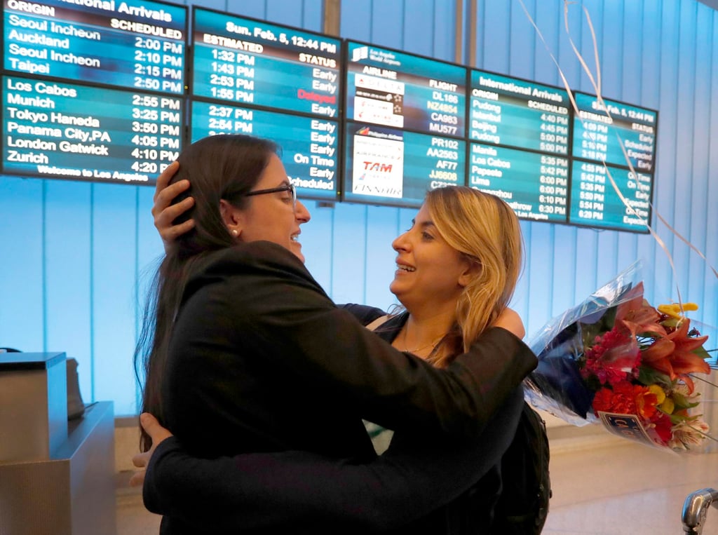Sahar Yarjani Muranovic (L) greets her sister, Iranian student Sara Yarjani, upon Sara’s arrival in Los Angeles in February 2017. Yarjani had been detained for 23 hours during a travel ban. Photo: EPA Sahar Yarjani Muranovic (L) greets her sister, Iranian student Sara Yarjani, upon Sara’s arrival in Los Angeles in February 2017. Yarjani had been detained for 23 hours during a travel ban. Photo: EPA