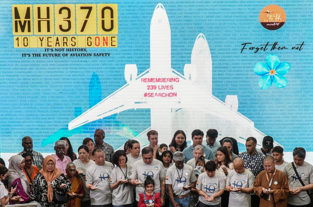 Relatives of passengers and crew on board the missing MH370 flight and Malaysia’s Transport Minister Loke Siew Fook gather at an event in Subang Jaya marking the 10th year of its disappearance. Photo: EPA-EFE Relatives of passengers and crew on board the missing MH370 flight and Malaysia’s Transport Minister Loke Siew Fook gather at an event in Subang Jaya marking the 10th year of its disappearance. Photo: EPA-EFE