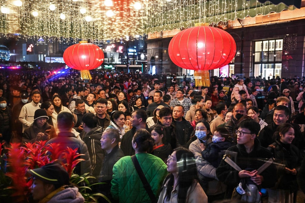 Crowds of people walk past the Peace Hotel on Shanghai’s Bund during the Lunar New Year holiday in February 2024. Photo: AFP Crowds of people walk past the Peace Hotel on Shanghai’s Bund during the Lunar New Year holiday in February 2024. Photo: AFP