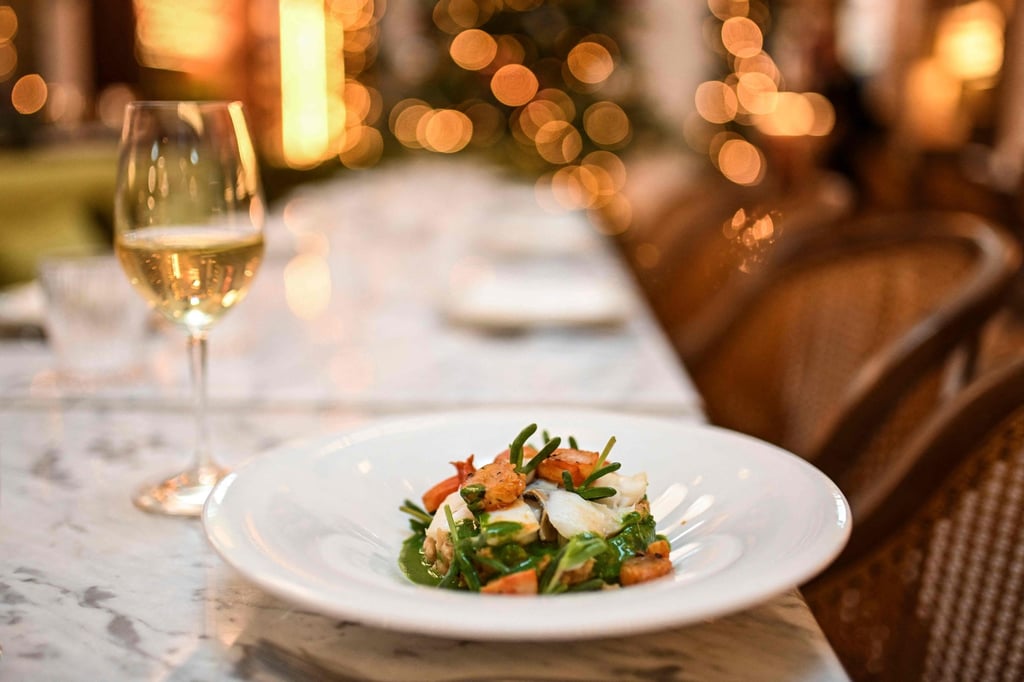Confit cod with açorda, a typical Portuguese dish, made with stale bread, shrimps, and drizzled with coriander juice, at Federico restaurant in Lisbon. Photo: AFP Confit cod with açorda, a typical Portuguese dish, made with stale bread, shrimps, and drizzled with coriander juice, at Federico restaurant in Lisbon. Photo: AFP