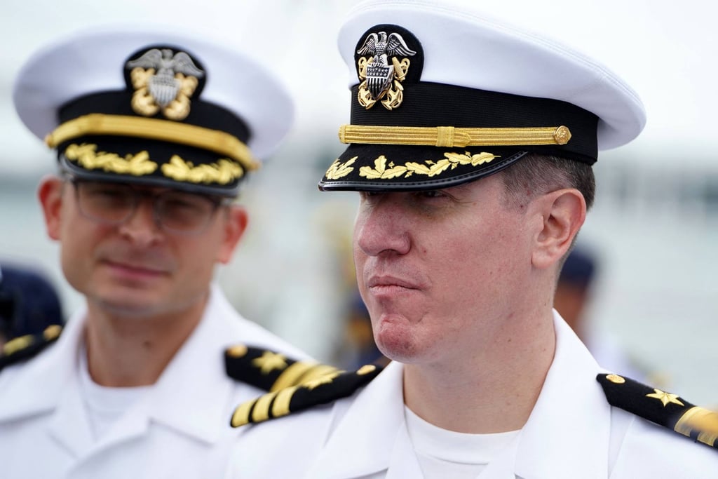 Daniel Sledz (right), commanding officer of the USS Savannah, looks on after the US warship docked in Cambodia’s port city of Sihanoukville on December 16. Photo: AFP Daniel Sledz (right), commanding officer of the USS Savannah, looks on after the US warship docked in Cambodia’s port city of Sihanoukville on December 16. Photo: AFP