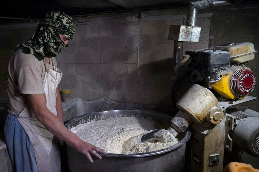 An Afghan baker prepares the dough for making flatbreads. At Jamil Ghafori’s bakery in Kabul, each step in the five-step process of making bread is assigned to a different baker. Photo: AFP An Afghan baker prepares the dough for making flatbreads. At Jamil Ghafori’s bakery in Kabul, each step in the five-step process of making bread is assigned to a different baker. Photo: AFP