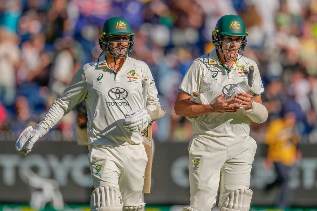 Australia’s Nathan Lyon (left) and Scott Boland walk off the field on the end of day four. Photo: AP Australia’s Nathan Lyon (left) and Scott Boland walk off the field on the end of day four. Photo: AP
