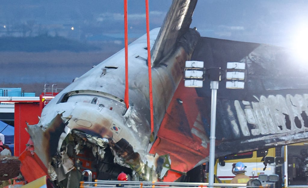 Firefighters and rescue personnel work near the scene where a Jeju Air Boeing 737-800 series aircraft crashed and burst into flames at Muan International Airport on December 29. Photo: AFP/Yonhap Firefighters and rescue personnel work near the scene where a Jeju Air Boeing 737-800 series aircraft crashed and burst into flames at Muan International Airport on December 29. Photo: AFP/Yonhap