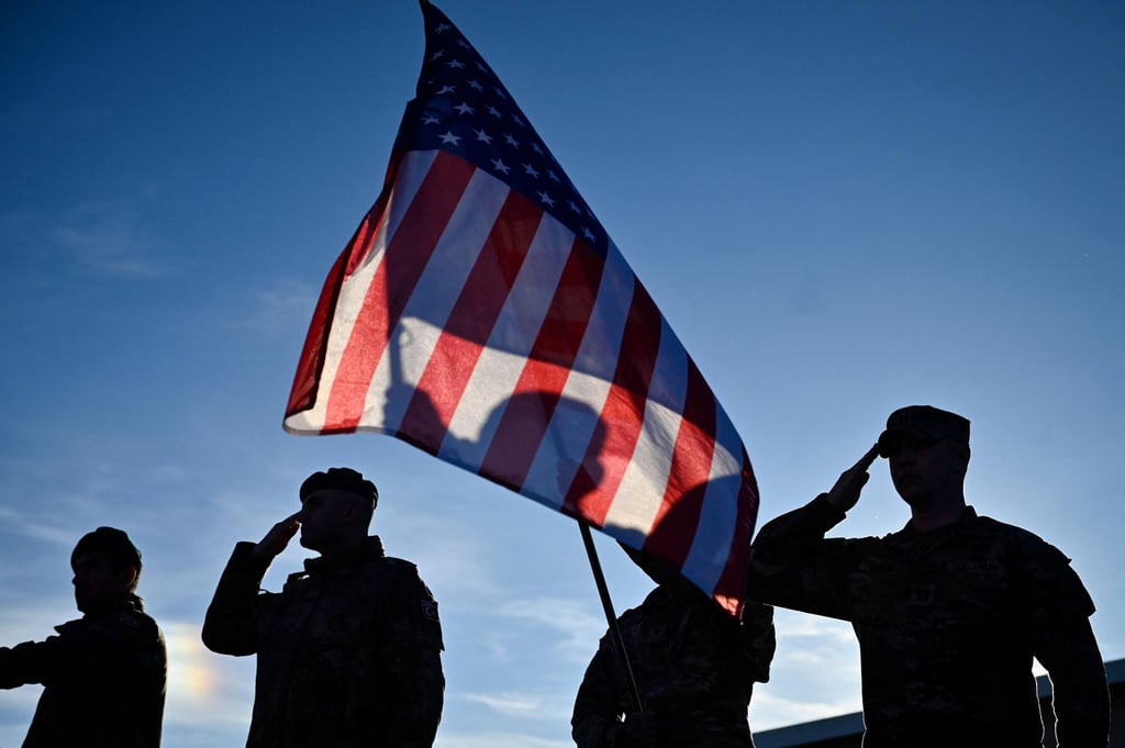 US soldiers, part of a Nato multinational battle group, stand in formation with a US flag during the visit of Nato Secretary General Mark Rutte at the Novo Selo military ground near Mokren, northwestern Bulgaria, on December 19. Photo: AFP US soldiers, part of a Nato multinational battle group, stand in formation with a US flag during the visit of Nato Secretary General Mark Rutte at the Novo Selo military ground near Mokren, northwestern Bulgaria, on December 19. Photo: AFP