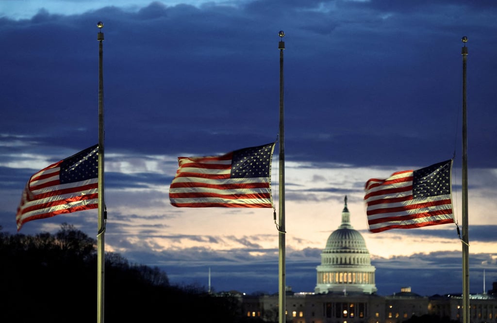 With the US Capitol in the distance, flags fly at half-staff at the Washington Monument. Photo: Reuters