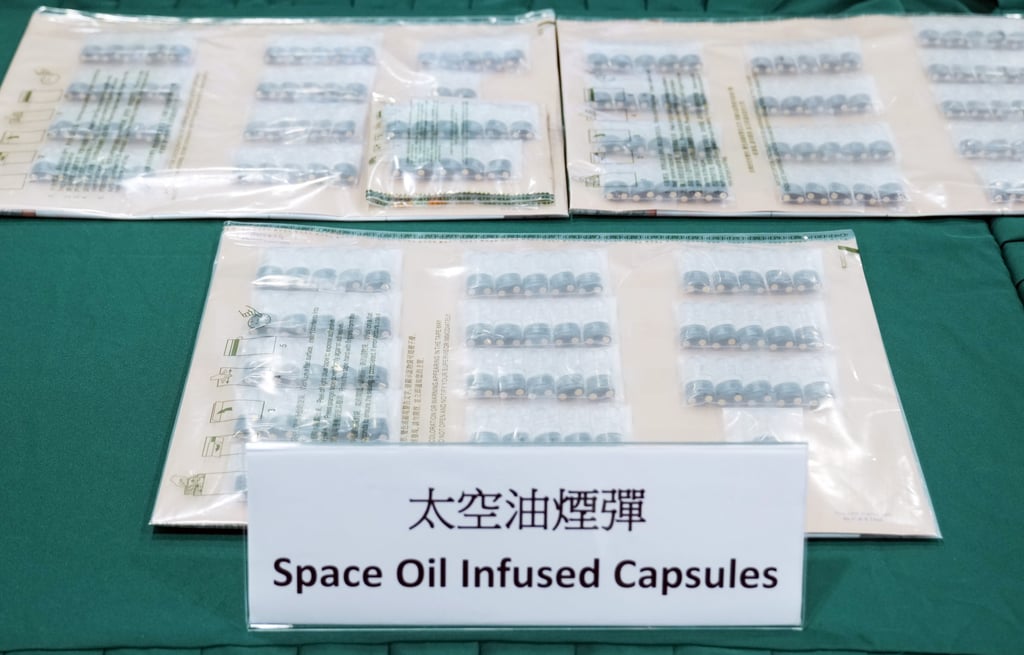 “Space oil” capsules are shown at a government press event. Photo: Sam Tsang “Space oil” capsules are shown at a government press event. Photo: Sam Tsang