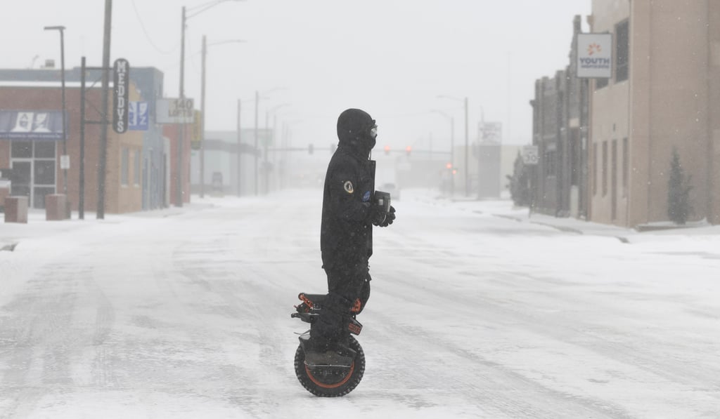 A man on a one-wheel electric scooter in Wichita, Kansas. Photo: The Wichita Eagle via AP