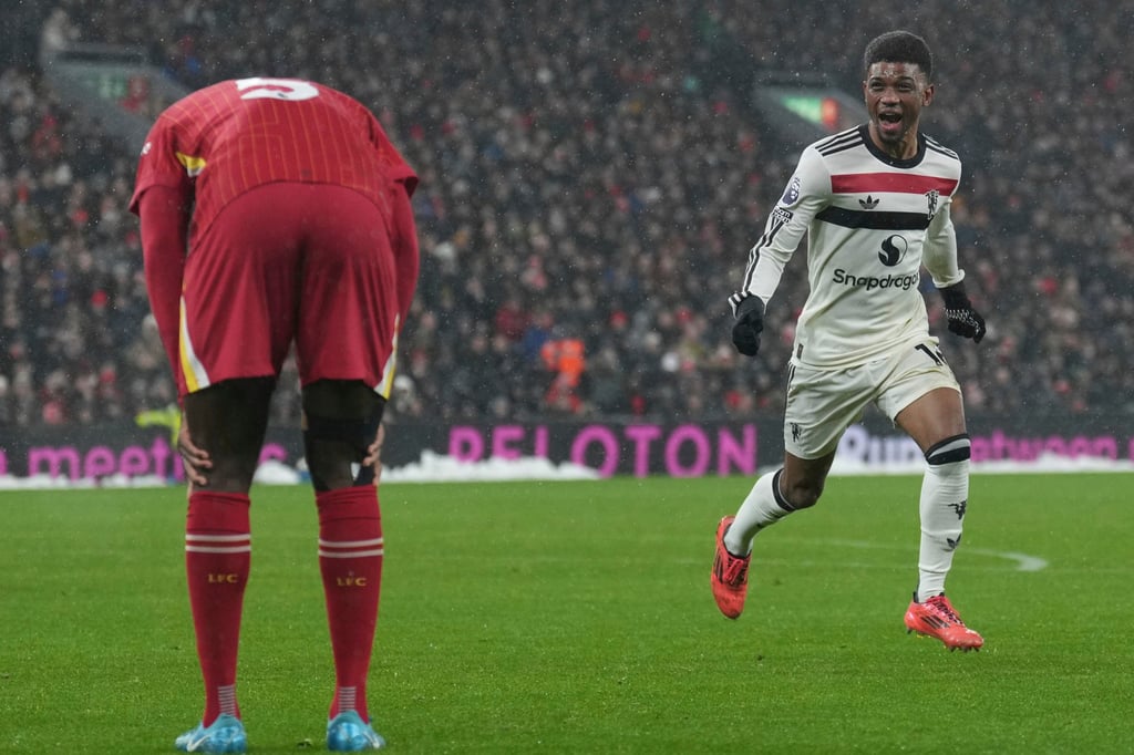 Manchester United’s Amad Diallo (right) runs away past Liverpool defender Ibrahima Konate after grabbing a late equaliser at Anfield. Photo: AP