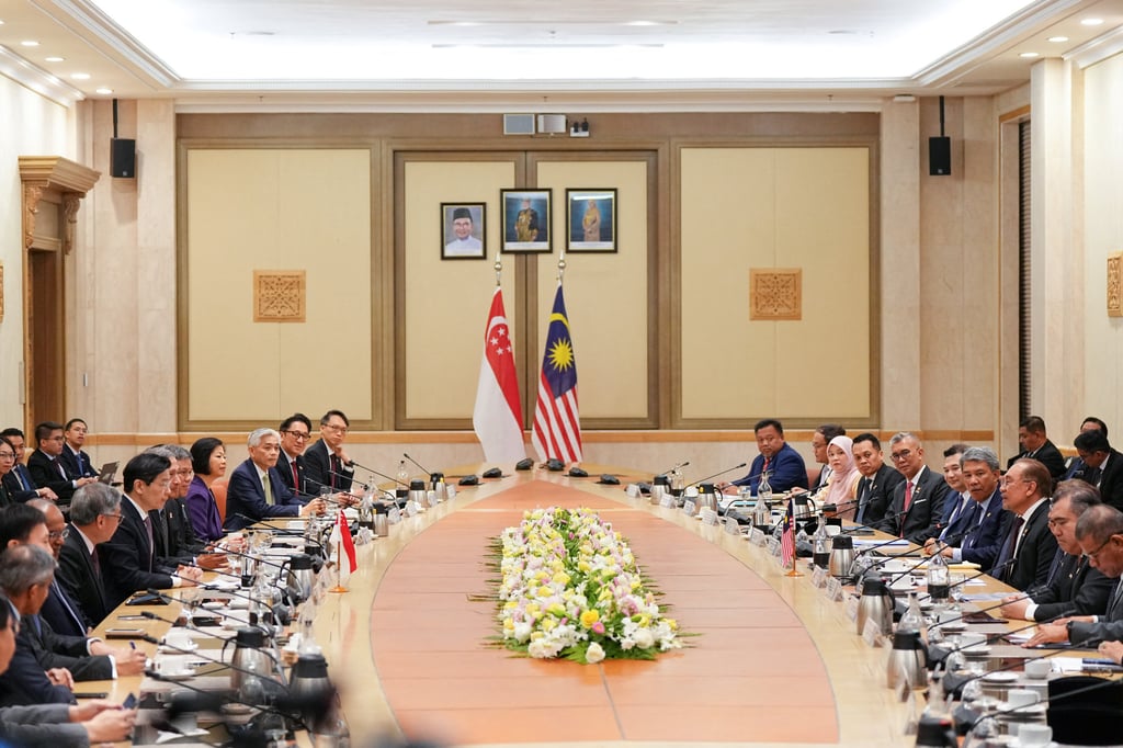 Malaysian Prime Minister Anwar Ibrahim and his cabinet ministers (right) hold talks with Singaporean leader Lawrence Wong and his delegation in Putrajaya on Tuesday. Photo: Reuters Malaysian Prime Minister Anwar Ibrahim and his cabinet ministers (right) hold talks with Singaporean leader Lawrence Wong and his delegation in Putrajaya on Tuesday. Photo: Reuters