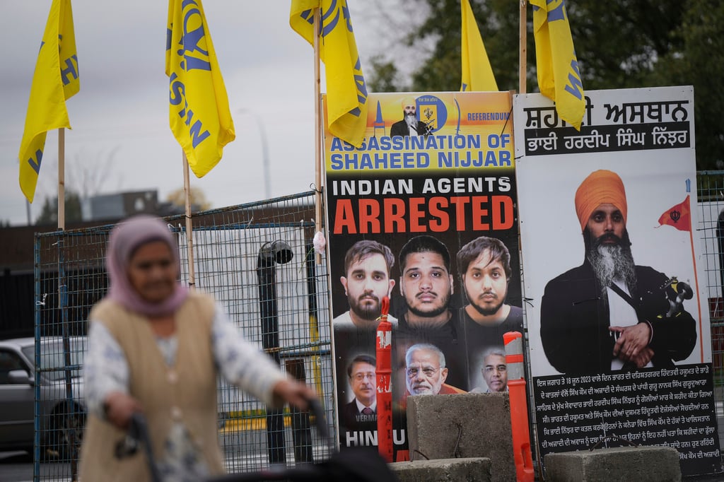 A photograph of Sikh leader Hardeep Singh Nijjar (back right) is displayed outside the Guru Nanak Sikh Gurdwara Sahib, in Surrey, British Columbia, in October 2024. Photo: The Canadian Press via AP A photograph of Sikh leader Hardeep Singh Nijjar (back right) is displayed outside the Guru Nanak Sikh Gurdwara Sahib, in Surrey, British Columbia, in October 2024. Photo: The Canadian Press via AP