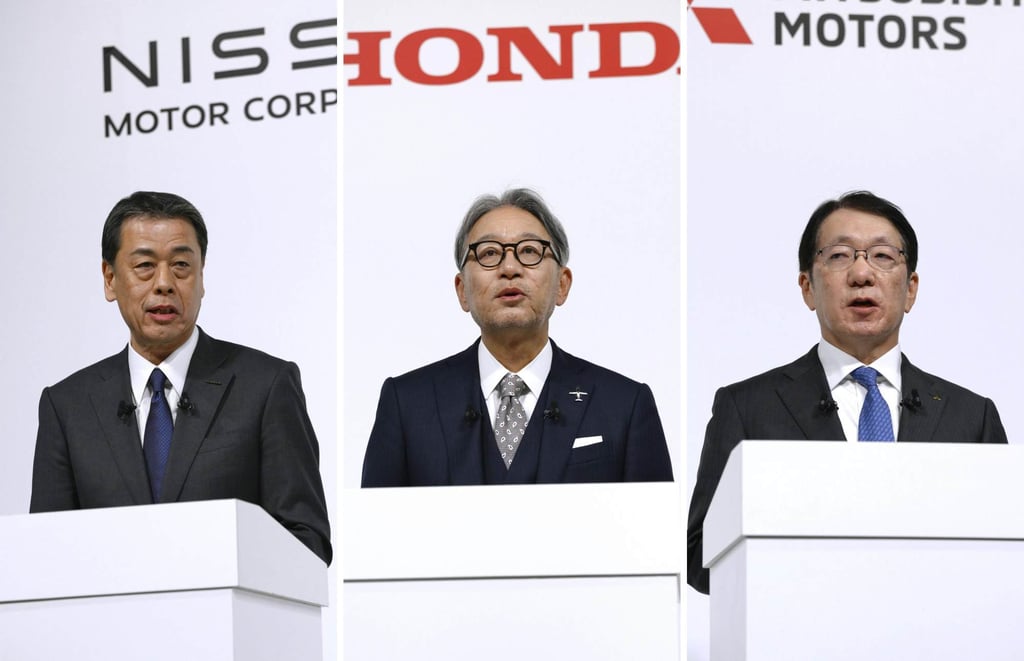 The presidents of Nissan Motor Co., Honda Motor Co. and Mitsubishi Motors Corp. (from left) Makoto Uchida, Toshihiro Mibe and Takao Kato – attending a joint press conference in Tokyo on December 23, 2024. Photo: Kyodo The presidents of Nissan Motor Co., Honda Motor Co. and Mitsubishi Motors Corp. (from left) Makoto Uchida, Toshihiro Mibe and Takao Kato – attending a joint press conference in Tokyo on December 23, 2024. Photo: Kyodo