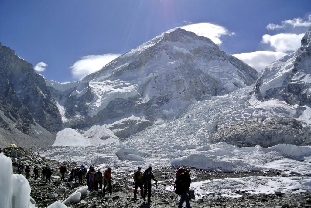 Climbers walk towards their helicopter (not pictured) in Nepal‘s Solukhumbu district near Mount Everest. Photo: Reuters Climbers walk towards their helicopter (not pictured) in Nepal‘s Solukhumbu district near Mount Everest. Photo: Reuters