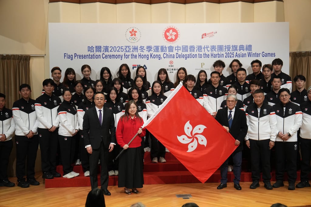 Secretary for Culture, Sports and Tourism Rosanna Law Shuk-pui holds the city’s flag at the ceremony. Photo: Elson Li
