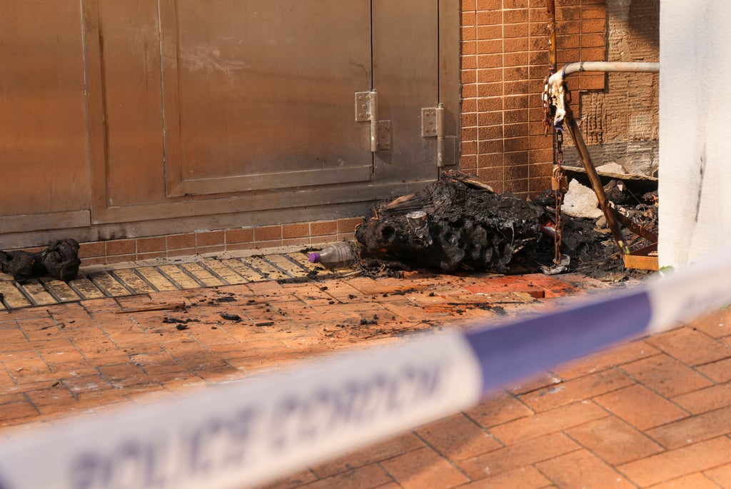 Remains of the trolley set aflame outside Shek Lei St. John’s Catholic Primary School in Kwai Chung. Photo: Jelly Tse Remains of the trolley set aflame outside Shek Lei St. John’s Catholic Primary School in Kwai Chung. Photo: Jelly Tse
