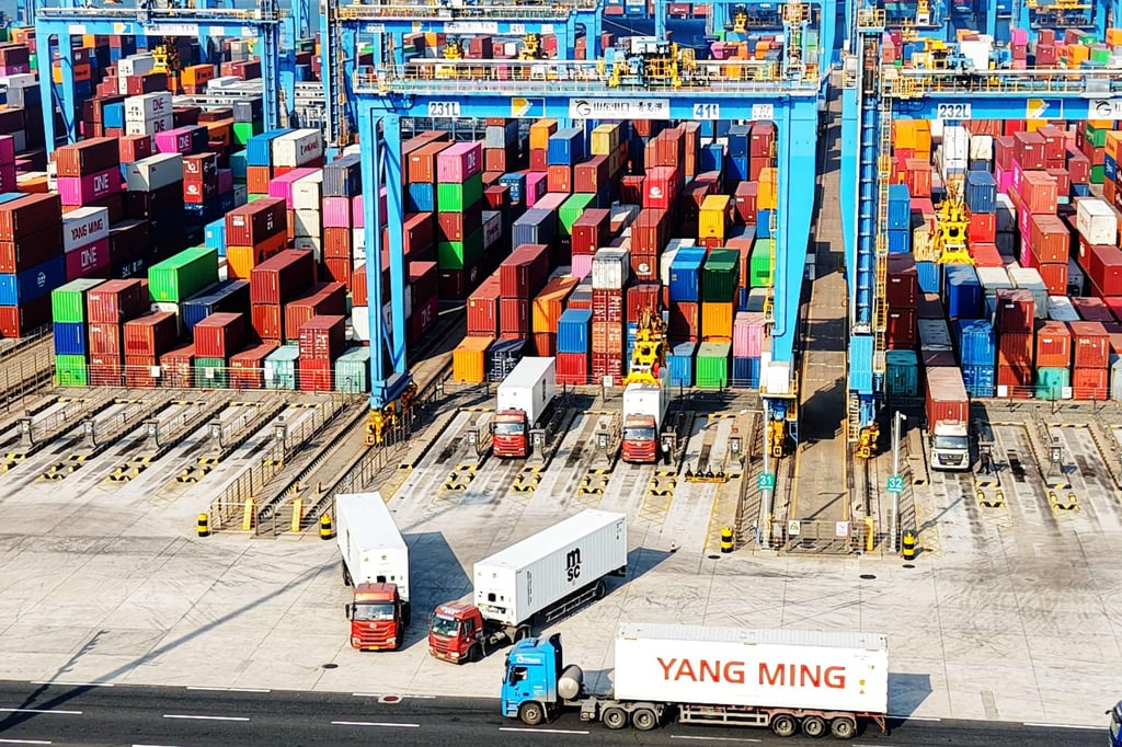 Trucks and containers in Qingdao Port in east China’s Shandong province. Photo: AFP Trucks and containers in Qingdao Port in east China’s Shandong province. Photo: AFP