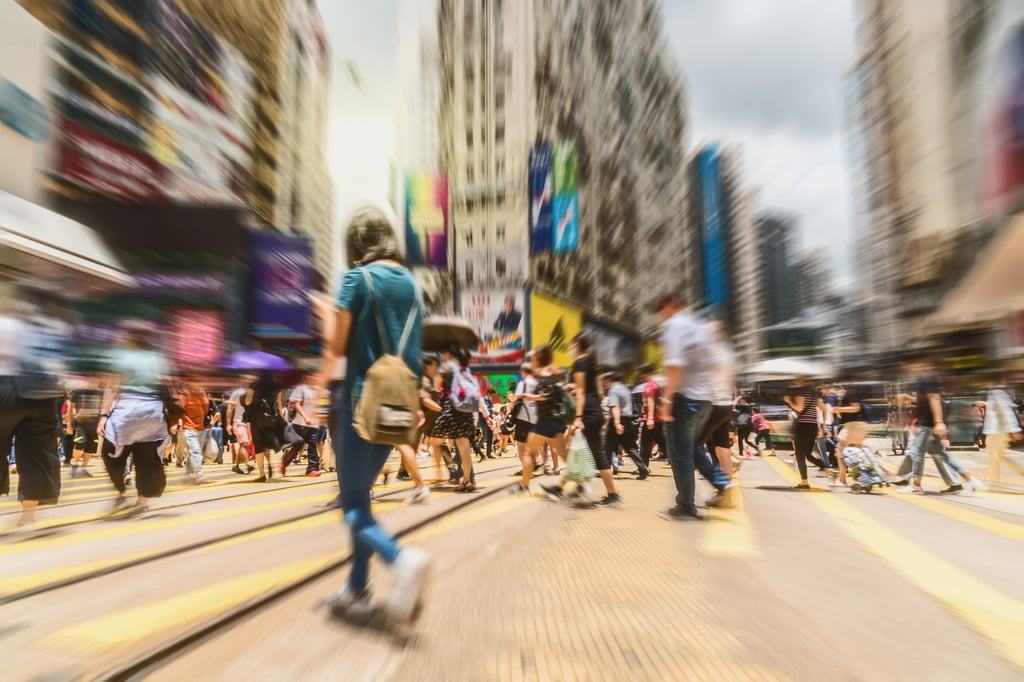 Shoppers and office workers at a crossing in Causeway Bay, Hong Kong. Photo: Shutterstock Shoppers and office workers at a crossing in Causeway Bay, Hong Kong. Photo: Shutterstock