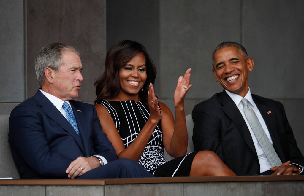 Former President George W. Bush, left, sits with ex-President Barack Obama, right, and former first lady Michelle Obama, centre. Photo: AP