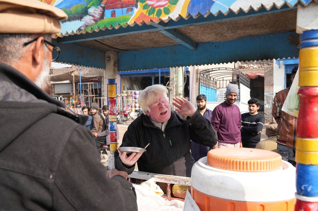 Bagga sings songs while selling kheer along a road in Sahiwal, Pakistan, on January 13, 2025. Photo: Reuters