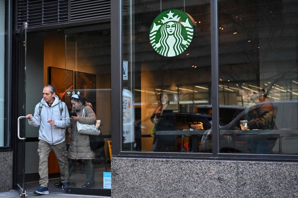People leaving a Starbucks in New York City. Shops in the US have blocked toilet access for non-paying customers. Photo: AFP People leaving a Starbucks in New York City. Shops in the US have blocked toilet access for non-paying customers. Photo: AFP