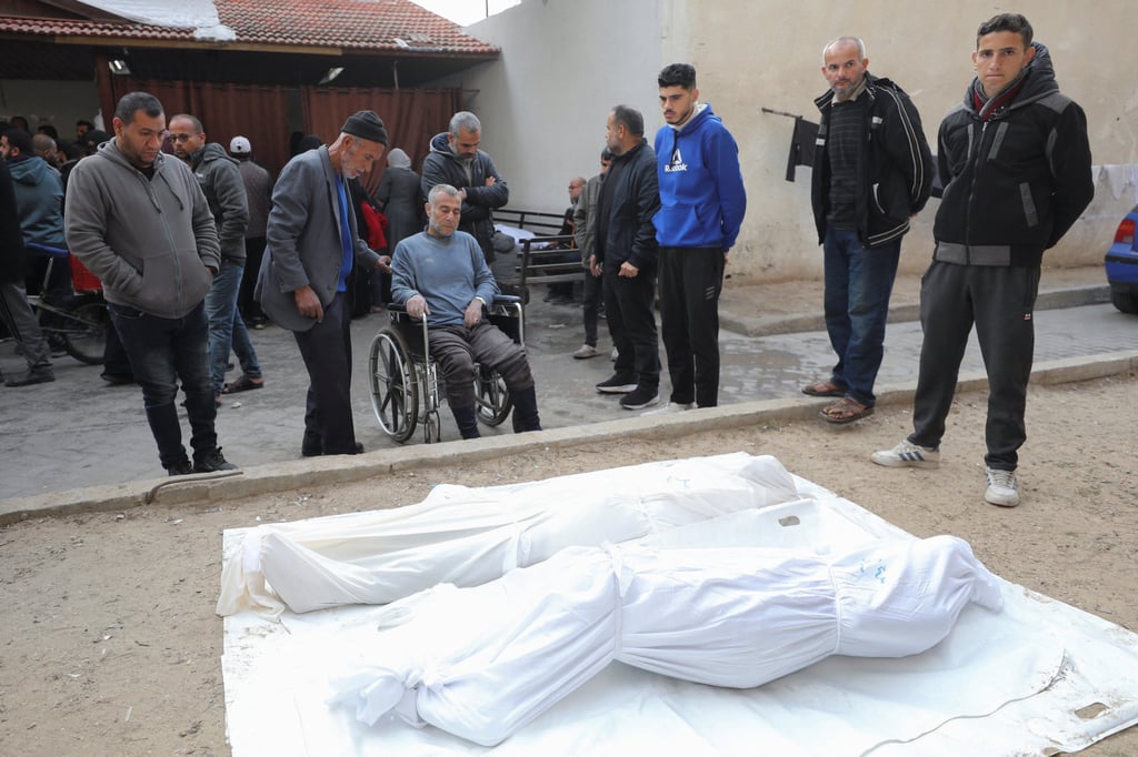 Bodies of Palestinians killed in Israeli strikes, ahead of a ceasefire set to take effect on Sunday. Photo: Reuters Bodies of Palestinians killed in Israeli strikes, ahead of a ceasefire set to take effect on Sunday. Photo: Reuters