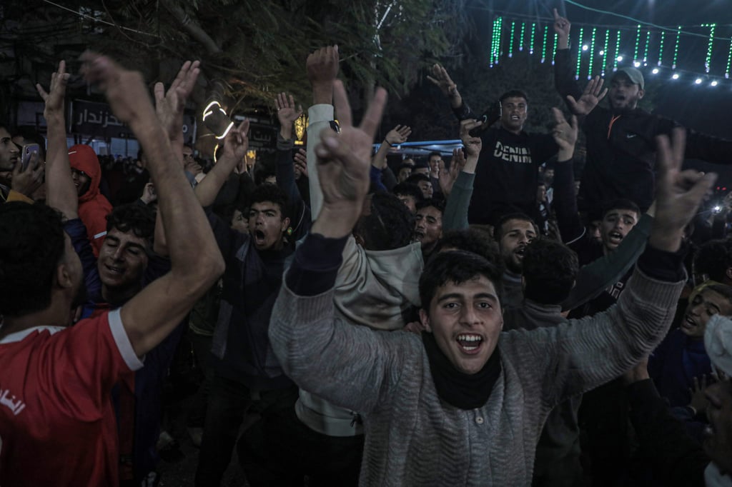 Palestinians in the central Gaza Strip react to news on the ceasefire deal on Wednesday. Photo: Xinhua Palestinians in the central Gaza Strip react to news on the ceasefire deal on Wednesday. Photo: Xinhua