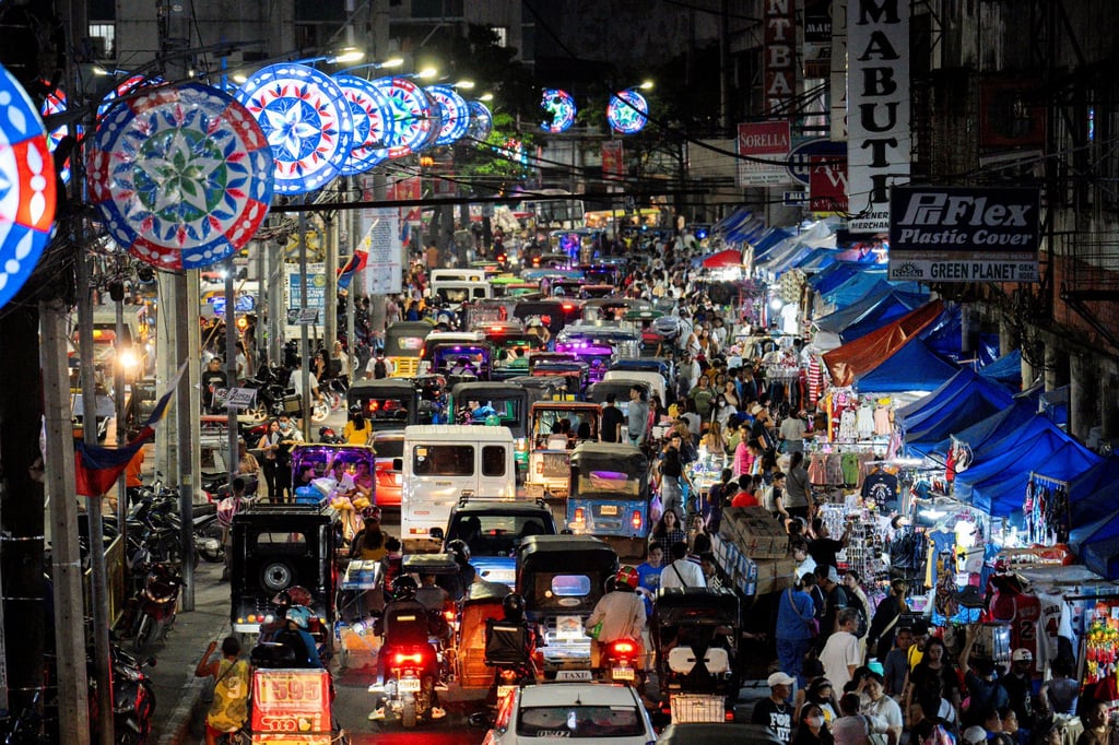 People at a Christmas market in Manila in December 2024. Lawmakers have raised concerns about an “off switch” that could enable Chinese engineers to rob the Philippines of its power with a single flick. Photo: Reuters