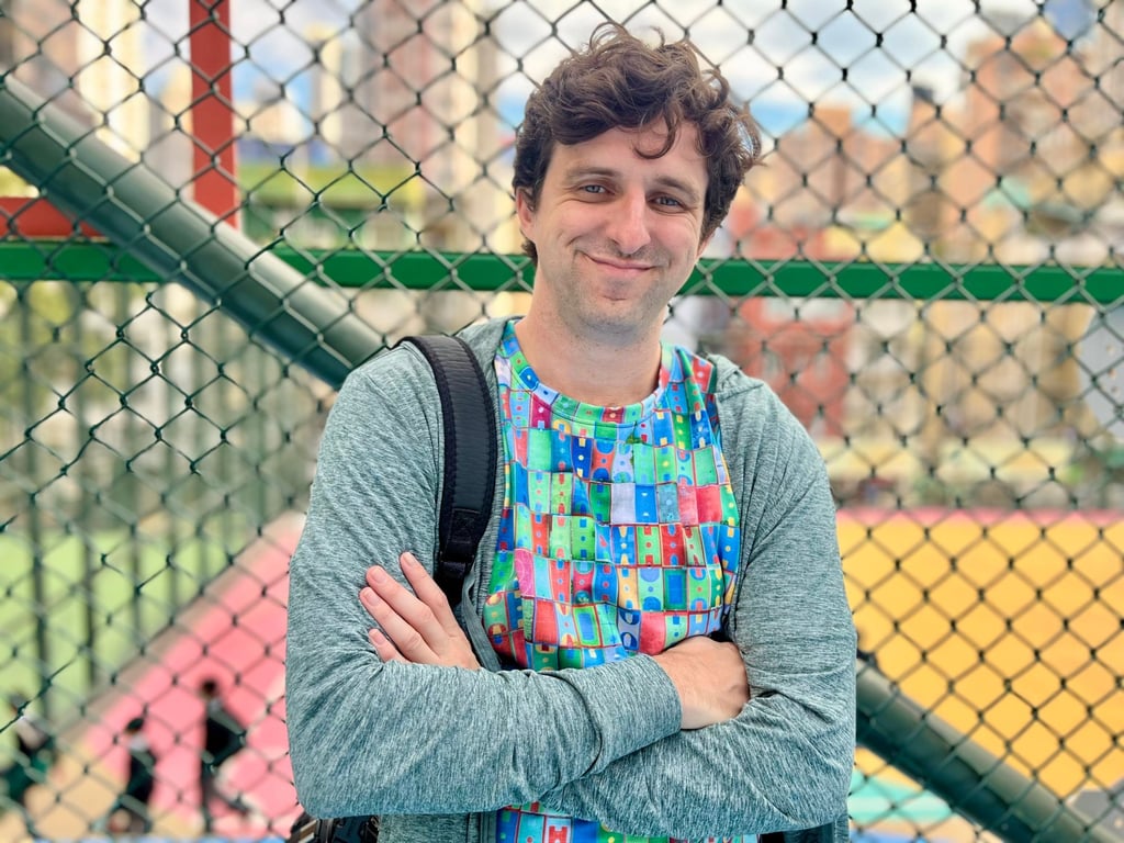 Photographer Austin Bell wears a colourful T-shirt featuring a mosaic of his photos. Photo: Kylie Knott Photographer Austin Bell wears a colourful T-shirt featuring a mosaic of his photos. Photo: Kylie Knott