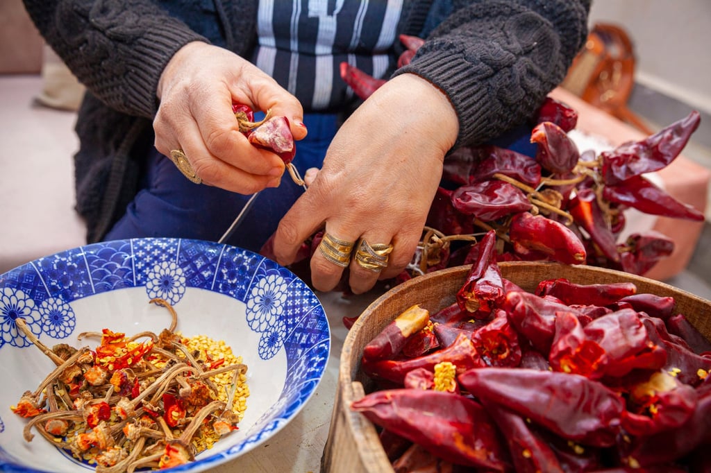 Harissa specialist Chahida Boufaied prepares the condiment – made with peppers, garlic, vinegar and spices – at her home in Nabeul, Tunisia. Photo: AP Harissa specialist Chahida Boufaied prepares the condiment – made with peppers, garlic, vinegar and spices – at her home in Nabeul, Tunisia. Photo: AP
