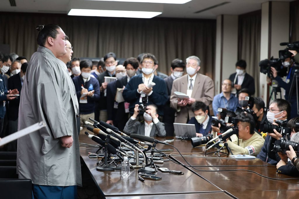 Terunofuji (left) told his retirement press conference in Tokyo he would now develop young sumo athletes. Photo: AFP Terunofuji (left) told his retirement press conference in Tokyo he would now develop young sumo athletes. Photo: AFP